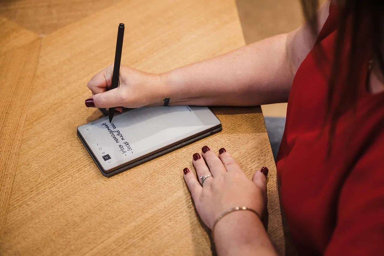 Lady writing in notepad
